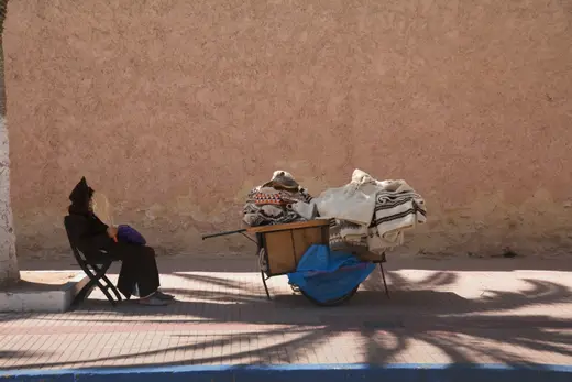 Man-and-cart-under-palm-tree.jpg